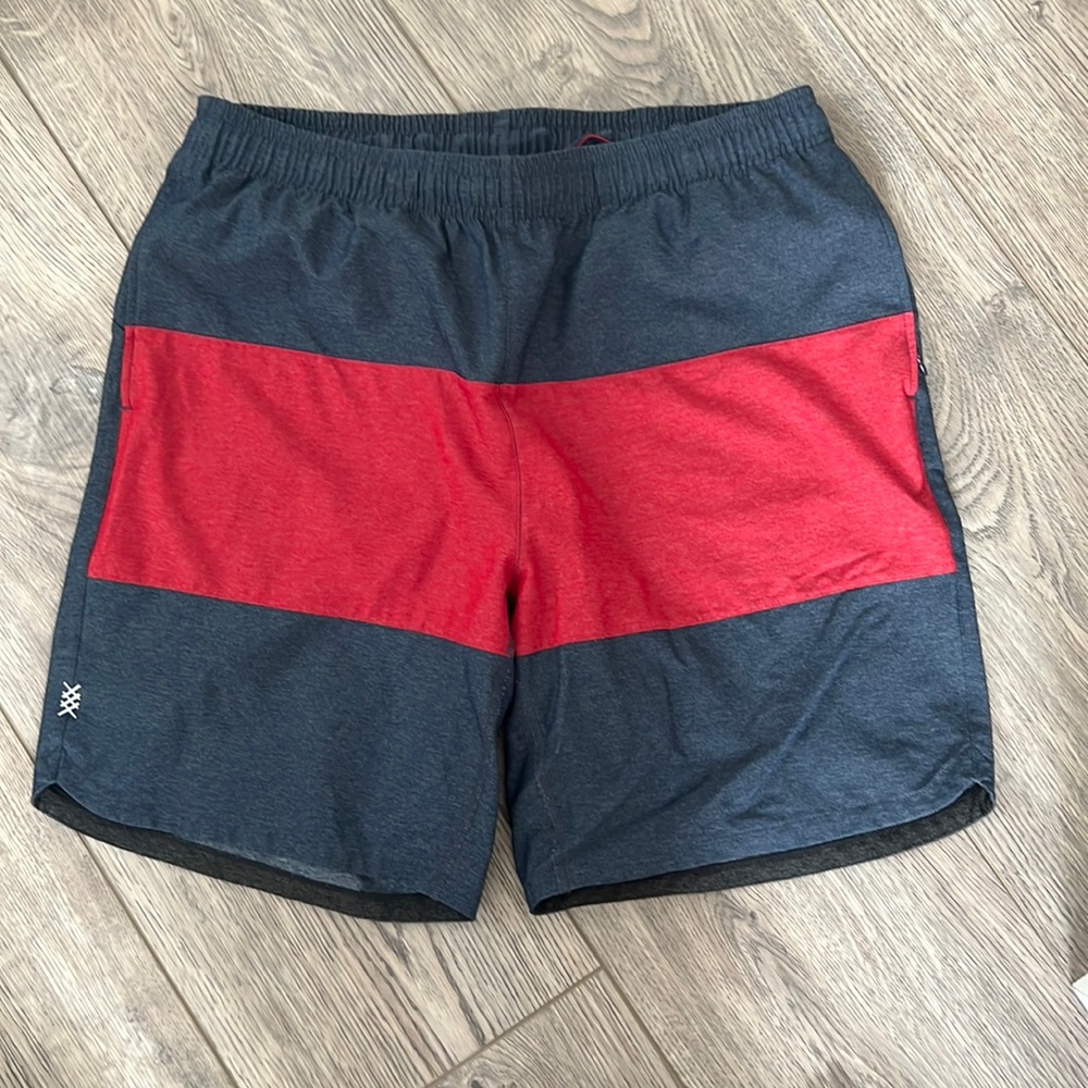 Men’s large red on blue Rhône shorts. Very lightly worn.